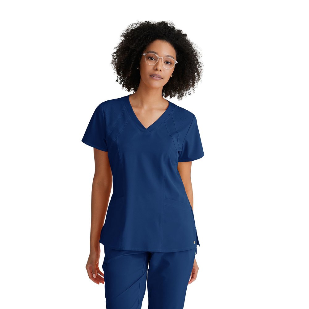 BARCO One Racer Classic Fit Scrub Top for Women  Indigo, 4-Pocket V-Neck Scrub Shirt w/ 360 Spandex Stretch, Moisture Wicking, Anti-Static and Quick-Shed  XS, Regular Fit
