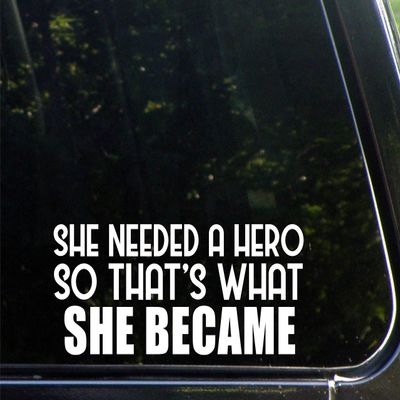 Sign Depot She Needed A Hero So That's What She Became- 8-3/4"x 3-1/2" - Vinyl Die Cut Decal/Bumper Sticker for Windows, Cars, Trucks, Laptops, Etc.