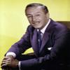 A Walt Disney wearing a navy suit Photo Print (24 x 30) view 1