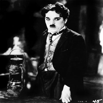 A film still of Charlie Chaplin Photo Print (8 x 10)