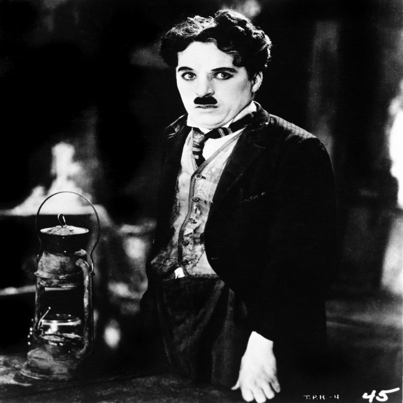 A film still of Charlie Chaplin Photo Print (8 x 10)