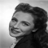 Carla Balenda in a Suit with Red Cape Photo Print (8 x 10) view 1