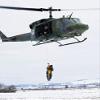 A student is hoisted into a UH-1N Iroquois during a training exercise Poster Print by Stocktrek Images (22 x 34) view 1