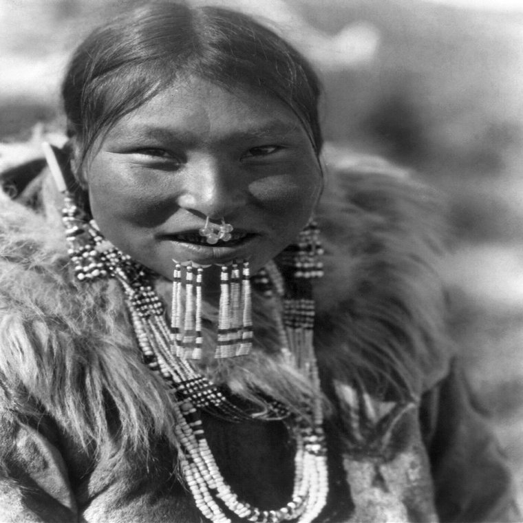 Alaska Eskimo Woman Neskimo Woman From Nunivak Island Wearing Necklaces Earrings A Nose Ornament And Beaded Labrets Below Her Lower Lip Alaska Photographed By Edward S Curtis C1929 Poster Print by (1