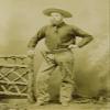 Armed Cowboy With Holster Ca 1890S - Full Dressed Cowboy With Holstered Pistol (You Can See Barrel At End Of Holster) Cartridge Belt Fringed Pants Cowboy Shirt And Great Cowboy Hat Poster Print by Bal view 1
