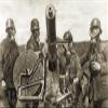 World War I Gas Warfare Na German Anti-Aircraft Machine Gun Crew Wearing Protective Masks In A Gas Zone Poster Print by (24 x 36) view 1