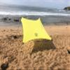 Neso Portable Beach Tent Sun Shelter with Sand Anchor - Lightweight Beach Shade Canopy - Easy Setup for Family Outings - Patented Reinforced Corners - UPF 50+ Sun Protection - 7 x 7ft - Lemon view 1