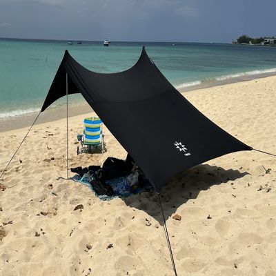 Neso Portable Beach Tent Sun Shelter with Sand Anchor - Lightweight Beach Shade Canopy - Easy Setup for Family Outings - Patented Reinforced Corners - UPF 50+ Sun Protection - 7 x 7ft - Black
