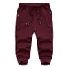 MAGNIVIT Men's 3/4 Joggers Gym Workout Training Sweatpants with Zipper Pockets 3/4 Pants Jogger Sweatpant Capris for Men Burgundy view 3