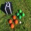BuyBocceBalls Listing - Unique Bocce Set - 107mm with Green and Orange Balls, Black Bag view 1
