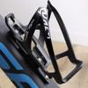 CyclingDeal Bicycle Bike Cycling Water Bottle Holder Cage Black + Bottle Cage Reposition Adaptor - Road or Mountain or Kids Bike Frame - Adjustable Position view 3