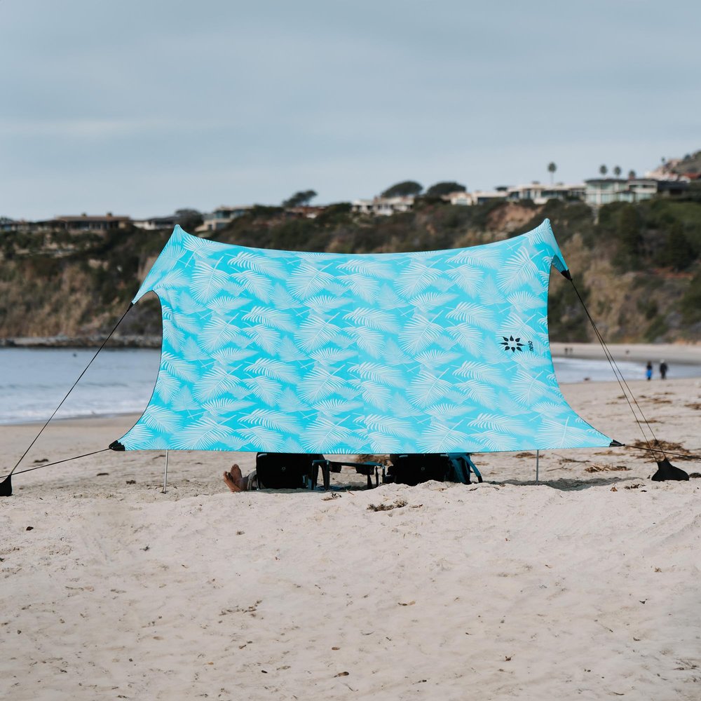 Neso Gigante Portable Beach Tent Sun Shelter - Lightweight Beach Shade Canopy - Easy Setup for Family Outings - Patented Reinforced Corners - UPF 50+ - 8ft Tall, 11 x 11ft - Aqua Fronds