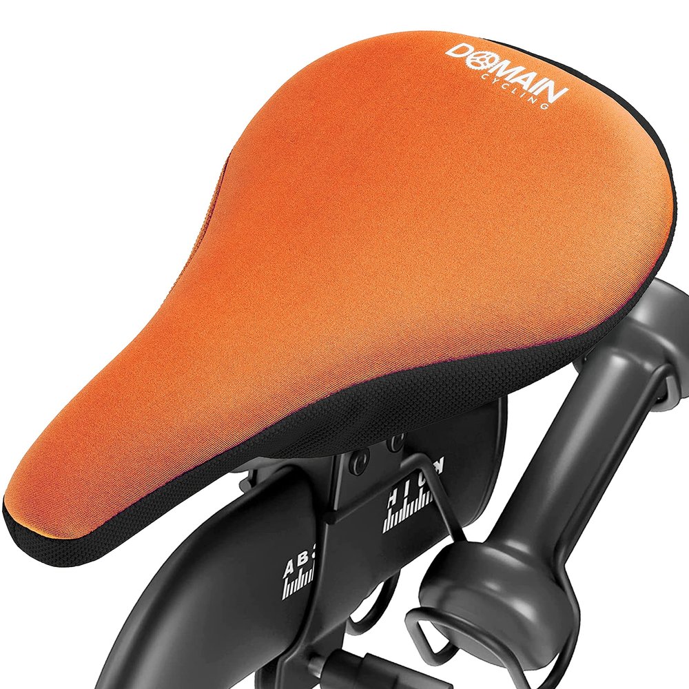 Domain Cycling Gel Bike Seat Cushion - Secure Peloton Fit for Smooth Stable Rides- Non-Slip Bicycle Cover for Exercise Bikes, Padded for Men or Women Comfort, 10.5x7