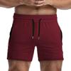 Men's Solid Gym Workout Shorts Bodybuilding Running Fitted Training Jogging Short Pants with Zipper Pocket 3 Colors (US Small : (Waist: 29.5"-31.5"), Red) view 2