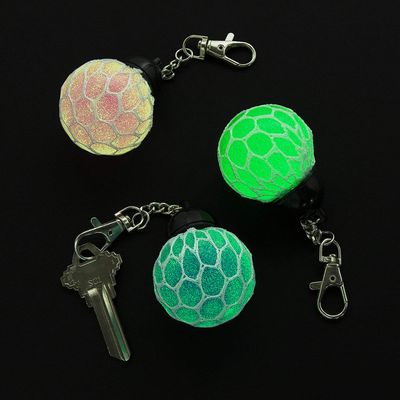 Fun Express Glow-in-the-Dark Mesh-Covered Squeeze Ball Backpack Clips  Fun & Stress-Relieving Party Favors Accessories for Kids School Supplies & Gifts  Perfect for Backpacks & Keychains  12 Pieces