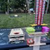 CornholeAce Elite Cornhole Scoreboard 5.5 Ft Tall Hardware Free Stand with Recording Shelf 2 Cup Holders Tablet Score Keeper Interchangeable UV Printed Top view 3