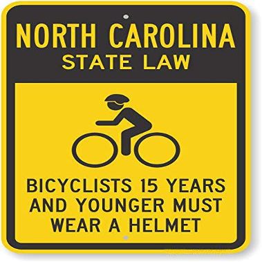 The Sign Studio - 18 x 24  North Carolina State Law Bike Sign: Bicyclists 15 Years and Younger Must Wear A Helmet (with Cyclists Symbol)