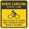 The Sign Studio - 18 x 24  North Carolina State Law Bike Sign: Bicyclists 15 Years and Younger Must Wear A Helmet (with Cyclists Symbol) view 1