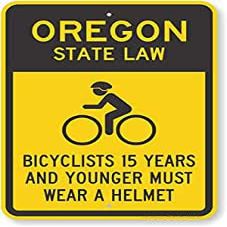 The Sign Studio - 18 x 24  Oregon State Law Bike Sign: Bicyclists 15 Years and Younger Must Wear A Helmet (with Cyclists Symbol)