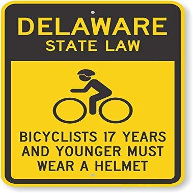 The Sign Studio - 18 x 24  Delaware State Law Bike Sign: Bicyclists 17 Years and Younger Must Wear A Helmet (with Cyclists Symbol)