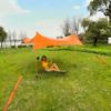 Red Suricata Premium Multi-Terrain Beach Tent & Beach Canopy in Backpack, UPF50 Sun Beach Shade, Pop Up Camping & Picnic Sunshade with 4 Poles, 4 Pole Anchors & 4 Tent Screws, Sun Shelter (Med Orange) view 1