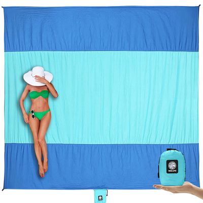 WEKAPO Beach Blanket Sandproof, Extra Large Beach Mat, Big & Compact Sand Free Mat Quick Drying, Lightweight & Durable with 6 Stakes & 4 Corner Pockets (Blue, 9x7 FT (15 Person))