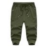 MAGNIVIT Capris for Men Athletic Below The Knee Shorts with Zipper Pockets 3/4 Pants Jogger Sweatpant Capris for Men Army Green view 3