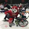 SPOTSOUND Polar bear REDBROKOLY Mascot in red hockey gear view 1