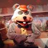 SPOTSOUND Gray mouse REDBROKOLY Mascot in red and yellow costume view 1