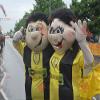 SPOTSOUND REDBROKOLY Mascot of man and woman of couple of supporters view 1