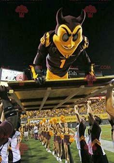 SPOTSOUND Black and yellow devil REDBROKOLY Mascot in sportswear