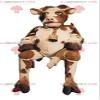 SPOTSOUND Brown and white cow REDBROKOLY Mascot with a bell