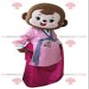 SPOTSOUND Brown monkey REDBROKOLY Mascot dressed in pink dress view 1