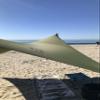 Neso Portable Beach Tent Sun Shelter with Sand Anchor - Lightweight Beach Shade Canopy - Easy Setup for Family Outings - Patented Reinforced Corners - UPF 50+ Sun Protection - 7 x 7ft - Army Green view 2