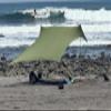 Neso Grande Portable Beach Tent Sun Shelter - Lightweight Beach Shade Canopy - Easy Setup for Family Outings - Patented Reinforced Corners - UPF 50+ Sun Protection - 7ft Tall, 9 x 9ft - Army Green view 2
