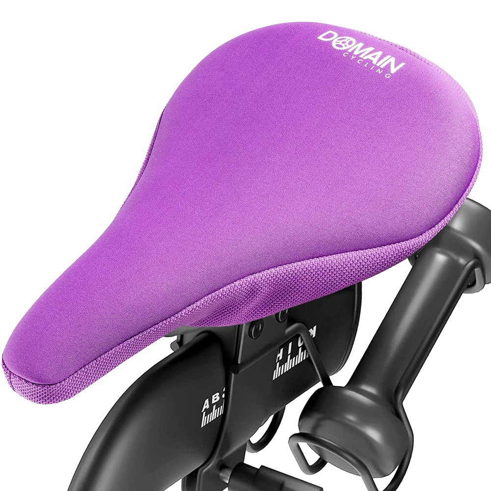Domain Cycling Bike Seat Cushion - Ultimate Comfort, Fits Peloton Seat Cushion and Most Exercise and Spin Bikes, Padded Gel Bike Seat Cover to Make Peloton Bicycle Seat Comfortable, 10.5x7 (Purple)