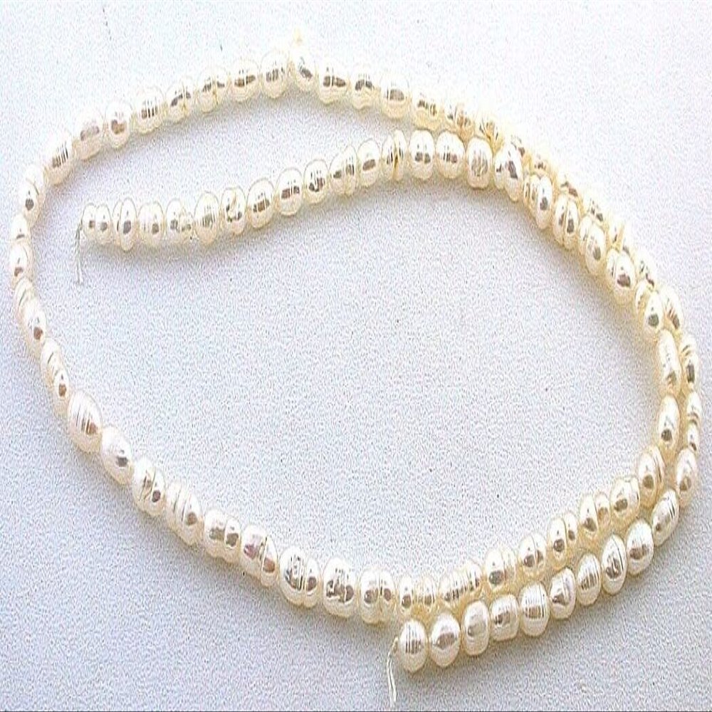 4mm to 7mm Oval Freeform Creme Freshwater Pearl 15 Inch Strand FWP118