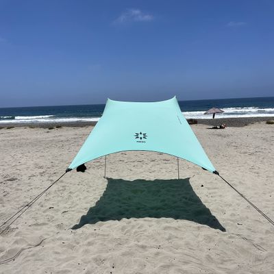 Neso Portable Beach Tent Sun Shelter with Sand Anchor - Lightweight Beach Shade Canopy - Easy Setup for Family Outings - Patented Reinforced Corners - UPF 50+ Sun Protection - 7 x 7ft - Seafoam