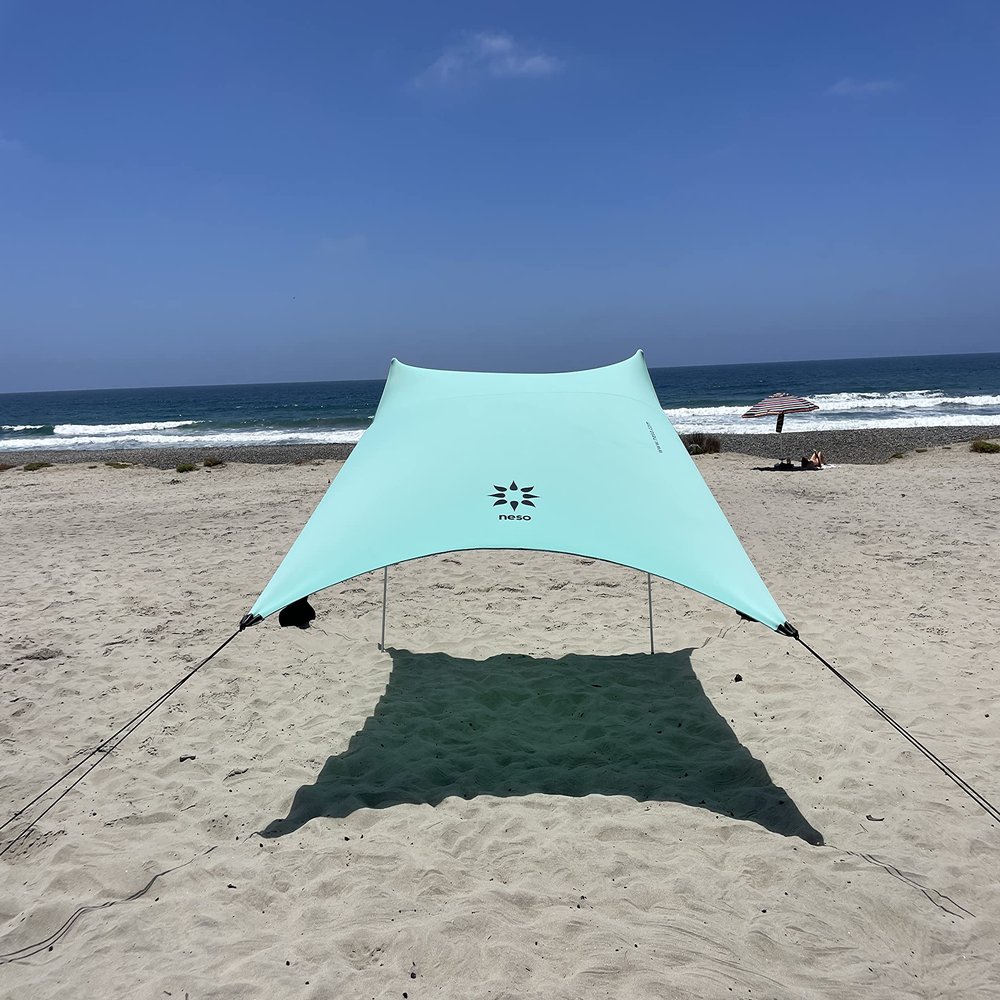 Neso Portable Beach Tent Sun Shelter with Sand Anchor - Lightweight Beach Shade Canopy - Easy Setup for Family Outings - Patented Reinforced Corners - UPF 50+ Sun Protection - 7 x 7ft - Seafoam