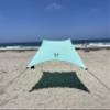 Neso Portable Beach Tent Sun Shelter with Sand Anchor - Lightweight Beach Shade Canopy - Easy Setup for Family Outings - Patented Reinforced Corners - UPF 50+ Sun Protection - 7 x 7ft - Seafoam view 1