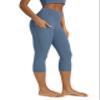 ODODOS Women's High Waisted Yoga Capris with Pockets,Tummy Control Non See Through Workout Sports Running Capri Leggings, Ink Blue, Small view 1