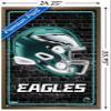 NFL Philadelphia Eagles - Neon Helmet 23 Wall Poster, 34L" x 22.4W", Bronze Framed Version view 3