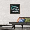 NFL Philadelphia Eagles - Neon Helmet 23 Wall Poster, 22.4L" x 14.7W", Mahogany Framed Version view 2