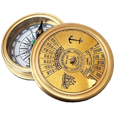 Antique Brass Finish Traveler's Pocket Poam Compass with a 100 -Year Calendar and Nautical Retro Style is a Useful Navigation Tool for Travelers.