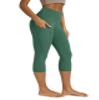 ODODOS Women's High Waisted Yoga Capris with Pockets,Tummy Control Non See Through Workout Sports Running Capri Leggings, Dark Green, Large view 1