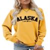 Pifnxtamy Sweatshirts for Women Alaska Letter Graphic Tees Retro Mountain Shirt Crewneck Sweater Long Sleeve Pullover Yellow view 1