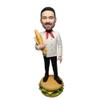 Bobblehead Figurine of a Baker Holding a Baguette on a Burger Base Toy for Private Collectibles Sculpture Handmade Clay Figurine