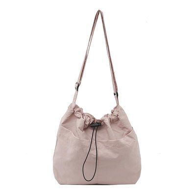 ALINUOYQ Women Stylish Crossbody Bag Large Capacity Nylon Drawstring Bucket Bag Lightweight Commuting Bag Adjustable Strap Multi-pockets for Outdoor Travel (Pink)